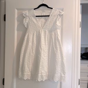 Very cute white mini romper/dress for summer.